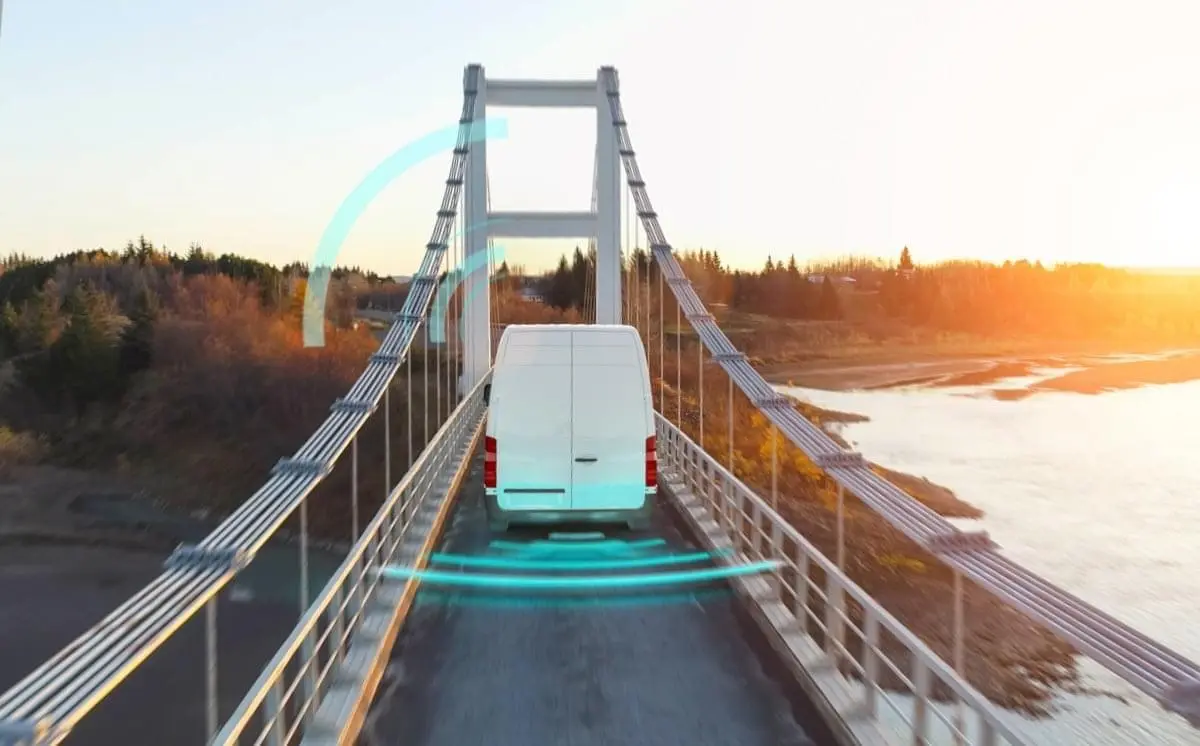 Van driving on a bridge